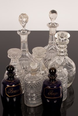 Lot 205 - A pair of Regency cut glass half-decanters of...