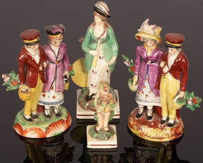 Lot 223 - A Staffordshire pearlware figure of a huntress,...