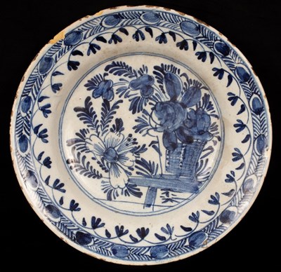 Lot 232 - A blue and white Delft plate, 19th Century,...