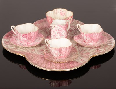 Lot 233 - A pink shell moulded tea service, Wileman & Co....