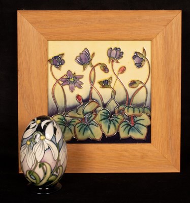 Lot 236 - A framed Moorcroft tile, 15cm x 15cm and a...