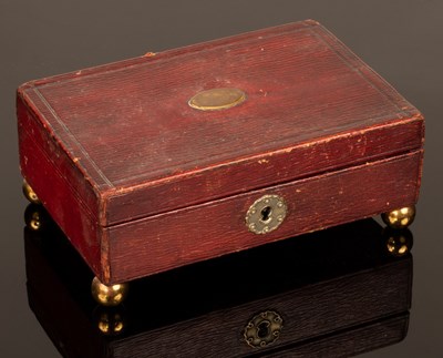 Lot 344 - A red leather sewing box, 15cm wide