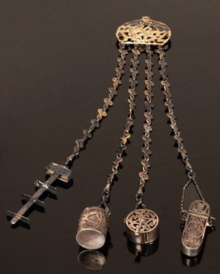 Lot 410 - A trefoil-shaped chatelaine, the silver links...