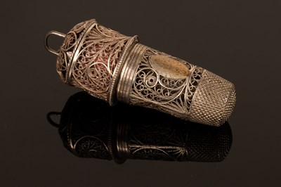 Lot 415 - A glass scent bottle in a thimble-shaped case...