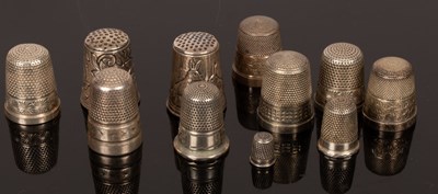 Lot 441 - Four sterling silver thimbles, three others,...