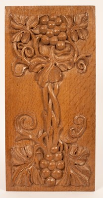 Lot 487 - A rectangular oak panel carved grapes and urns...