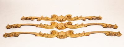 Lot 512 - A set of three carved giltwood window pelmets...