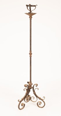 Lot 514 - A wrought iron floor standing pricket...