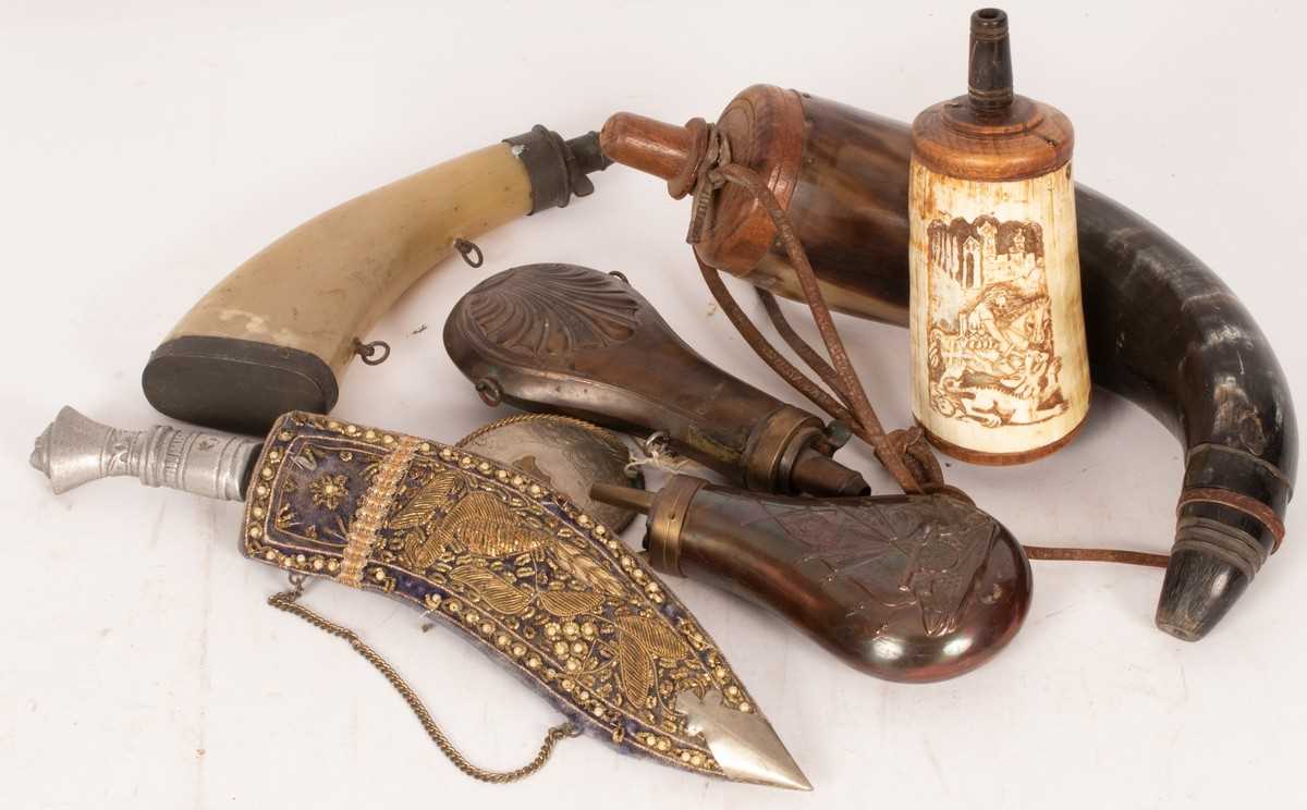 Lot 544 - Two embossed copper powder flasks, two other