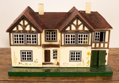 Lot 553 - A 1930s dolls house, with twin gable roof and...