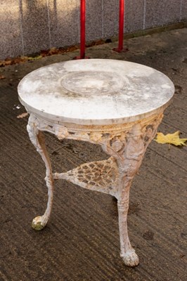 Lot 606 - A cast iron public house table on three hoof...