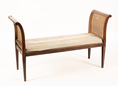 Lot 610 - A mahogany window seat with scroll ends, cane...