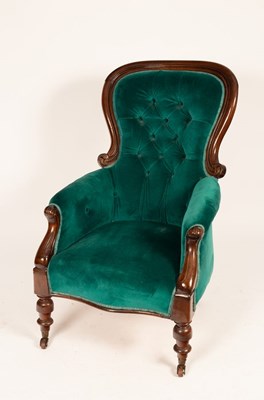 Lot 611 - A mahogany armchair with deep button back, on...