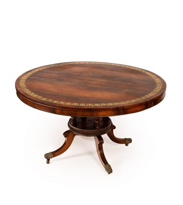 Lot 618 - A fine Regency rosewood dining table, the top...