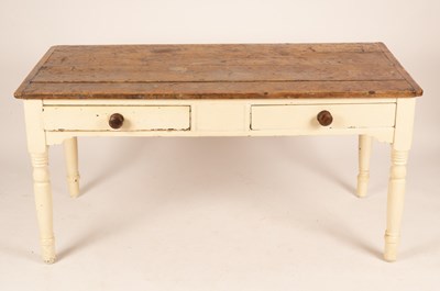 Lot 627 - A pine kitchen table fitted two drawers on...