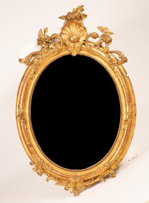 Lot 641 - An early Victorian giltwood oval wall mirror...