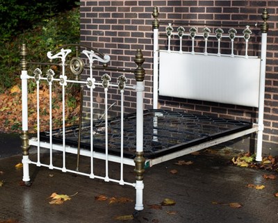 Lot 647 - A Victorian bedstead with brass mounts, the...