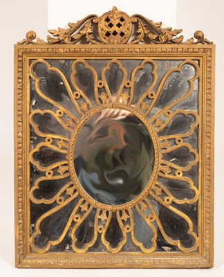 Lot 660 - A giltwood wall mirror with scrolling swan...