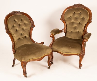 Lot 662 - A pair of Victorian walnut lady and...