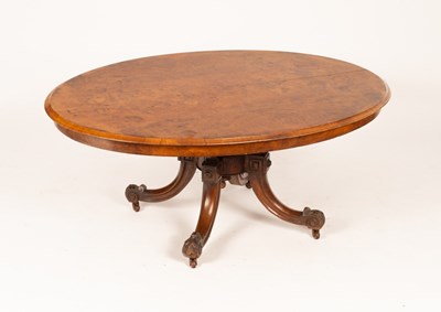 Lot 666 - A Victorian figured walnut oval table top on a...