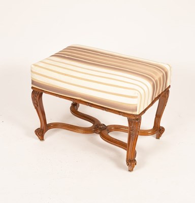 Lot 685 - An upholstered foot stool on carved and...