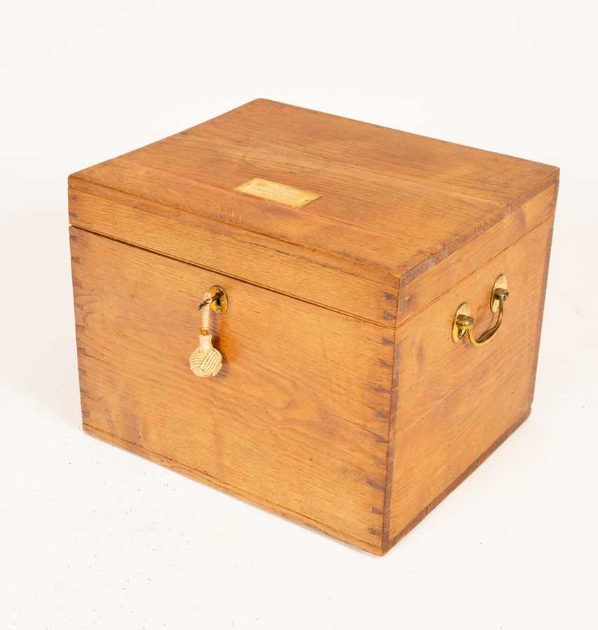 Lot 686 - An oak chest with brass handles and...