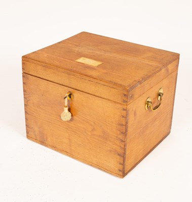 Lot 686 - An oak chest with brass handles and...