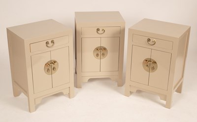 Lot 687 - Three Chinese grey painted bedside cupboards...