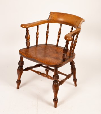 Lot 704 - A Victorian smokers bow chair, with shaped...