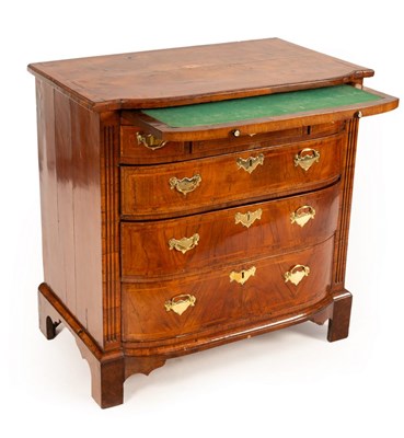 Lot 710 - A George II walnut broken D-front chest, the...