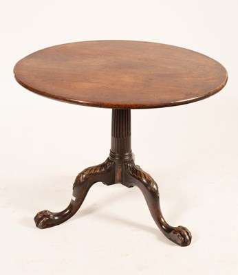 Lot 712 - A George II red walnut table, the circular top...