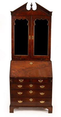 Lot 713 - A George III bureau bookcase, the broken...