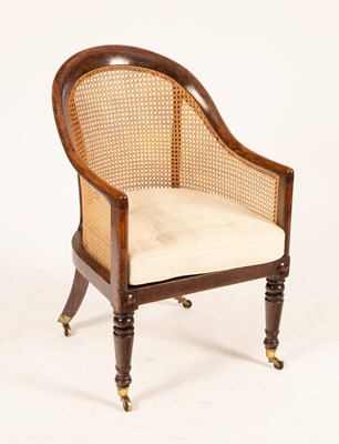 Lot 715 - A George IV simulated rosewood bergère, the...