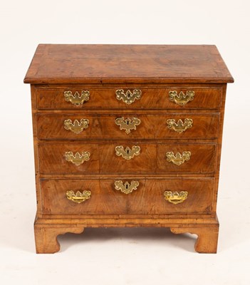 Lot 730 - A George I walnut chest, the crossbanded...