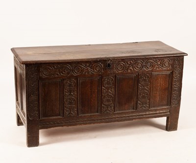 Lot 737 - A Jacobean and later adapted oak coffer, the...