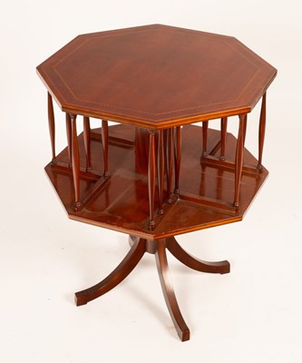 Lot 744 - An octagonal revolving bookcase, the top with...