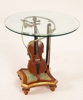 Lot 757 - A novelty occasional table, the glass top on a...