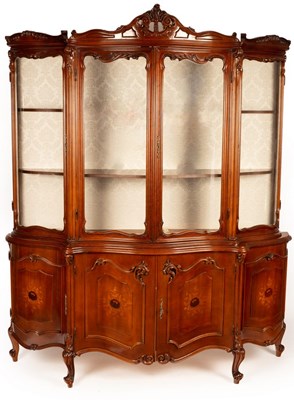 Lot 762 - A serpentine fronted display cabinet, the...