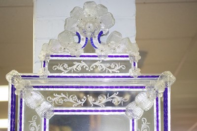 Lot 770 - A Venetian style glass wall mirror with blue...