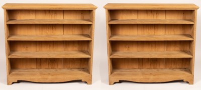 Lot 776 - A near pair of oak open bookcases, 125cm and...