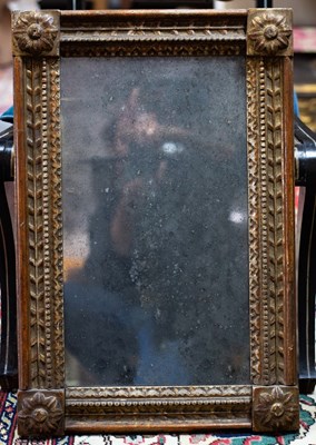 Lot 787 - A gilt framed wall mirror with rosette motifs...