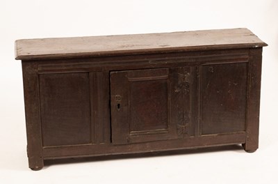 Lot 833 - An early 18th Century oak cupboard, the single...