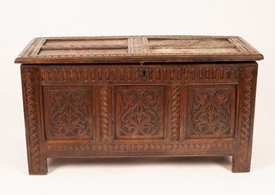 Lot 847 - A 17th Century oak coffer, the hinged panelled...