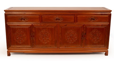 Lot 857 - A Chinese hardwood sideboard, fitted three...