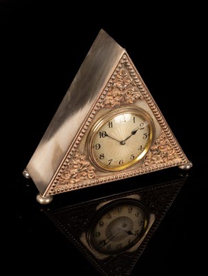 Lot 882 - A silver plate cased mantel clock of...