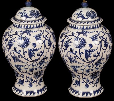 Lot 896 - A pair of blue and white floral vase-shaped...