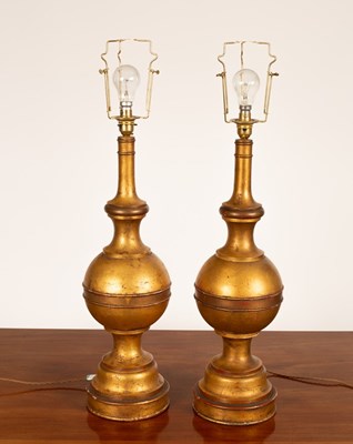 Lot 906 - A pair of gilt table lamps of turned form,...