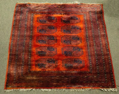 Lot 930 - A red Bokhara rug with blue details and...