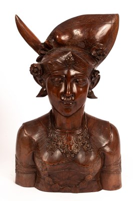 Lot 983 - A Barle carved wood figure of a female bust,...