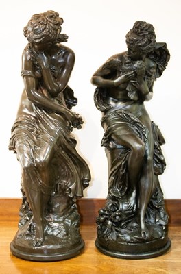 Lot 986 - Two resin statues each depicting a Classical...